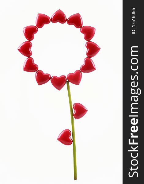 Celebratory flower from red hearts on Valentine's Day on a white background