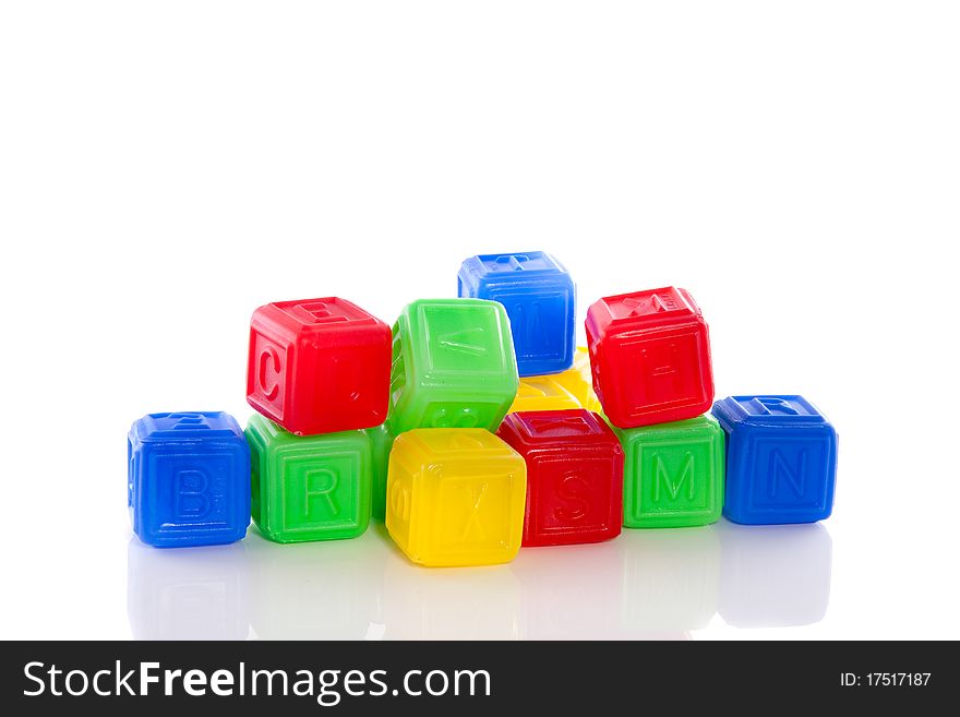 Colorful plastic alphabet play blocks  isolated on white background. Colorful plastic alphabet play blocks  isolated on white background