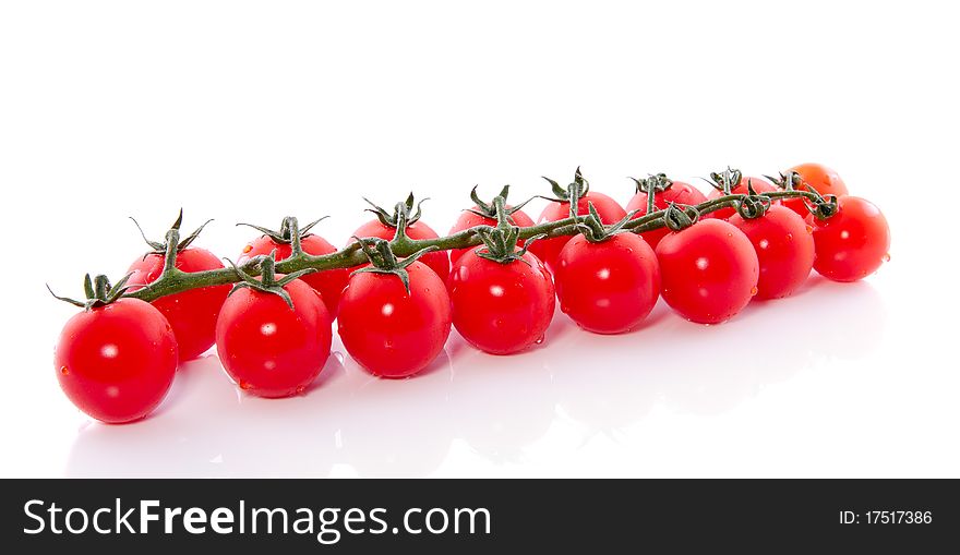 Healthy bunch of tomatoes isolated over white