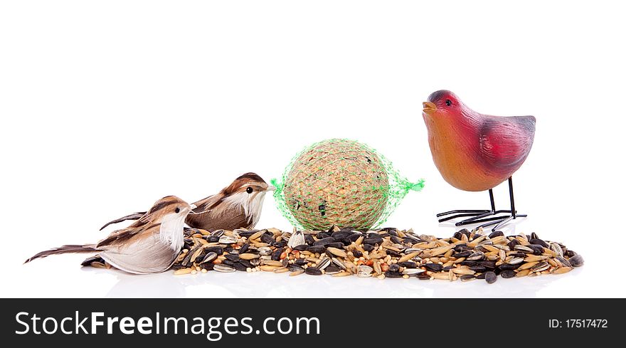 Birdseeds with decorative birds isolated over white