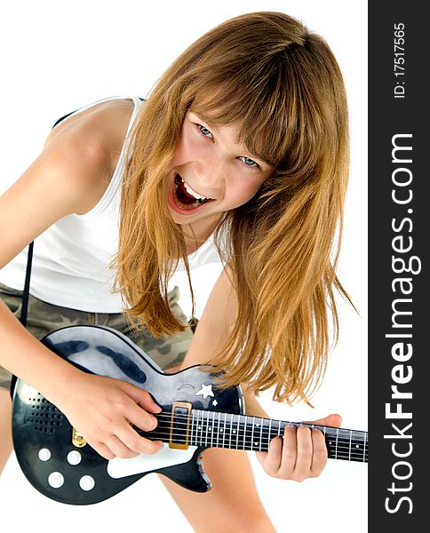Little blond girl playing the guitar screaming, isolated on white