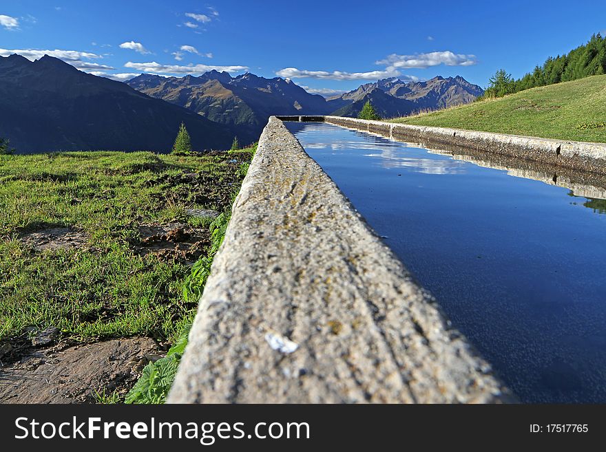 Fountain in the mountains during summer