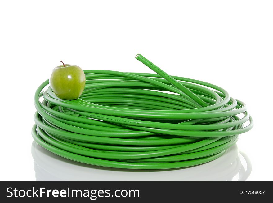 Green apple on top of an energy cable  isolated over white. Green apple on top of an energy cable  isolated over white