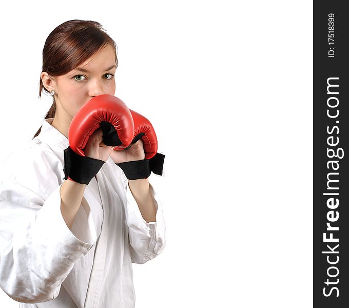 Girl in kimono with red boxing gloves against white background. . Girl in kimono with red boxing gloves against white background.