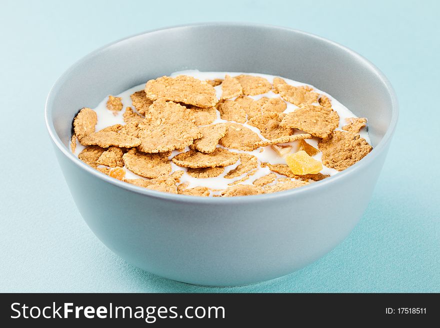 Healthy breakfast - milk with corn flakes in a bowl