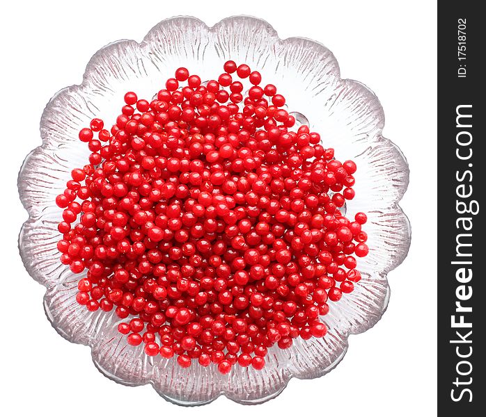 Red berries of viburnum on glass plate isolated on white background