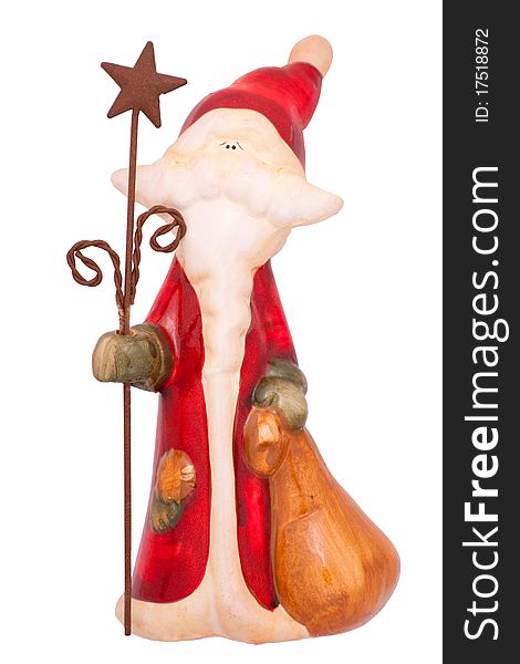 Isolated colored ceramic Santa with bag and staff