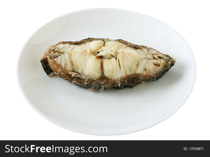 Boiled fish on an white plate. Boiled fish on an white plate