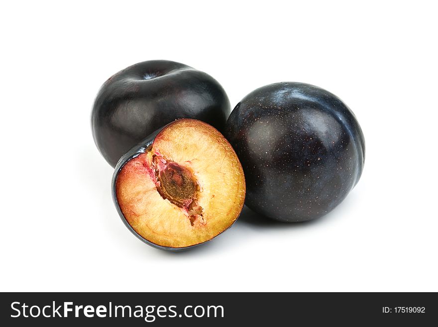 Two plum isolated on white