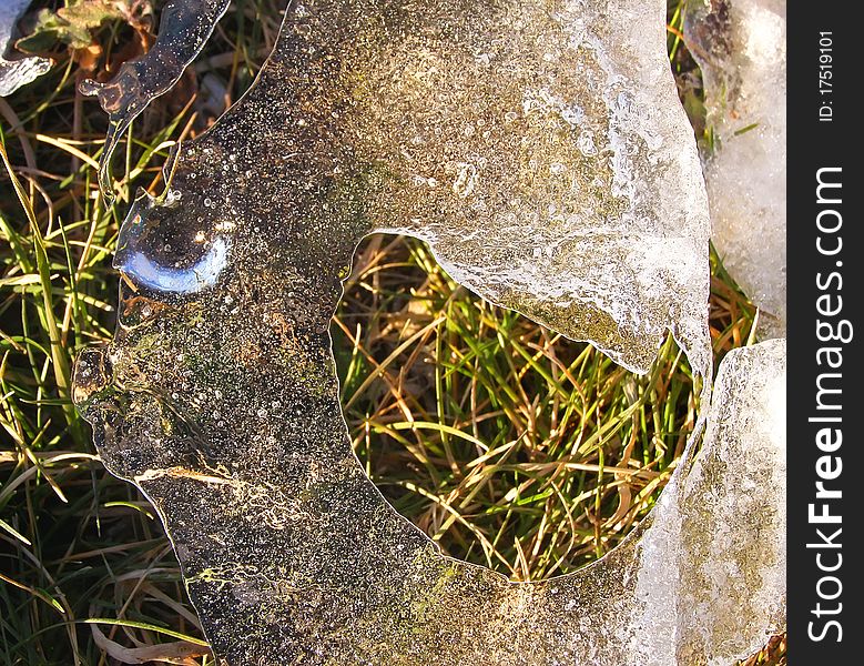 Spring view of ice on the grass