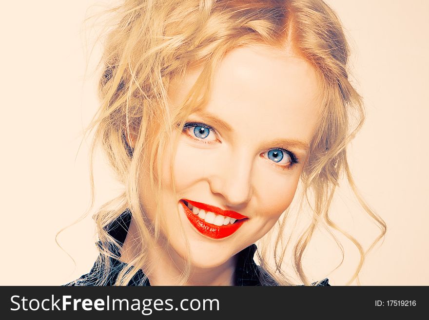 Portrait of a blond lady with a beautiful hair and red lips