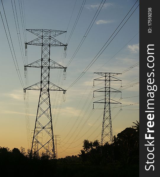 View of electricity pylon and cable during sunset. View of electricity pylon and cable during sunset