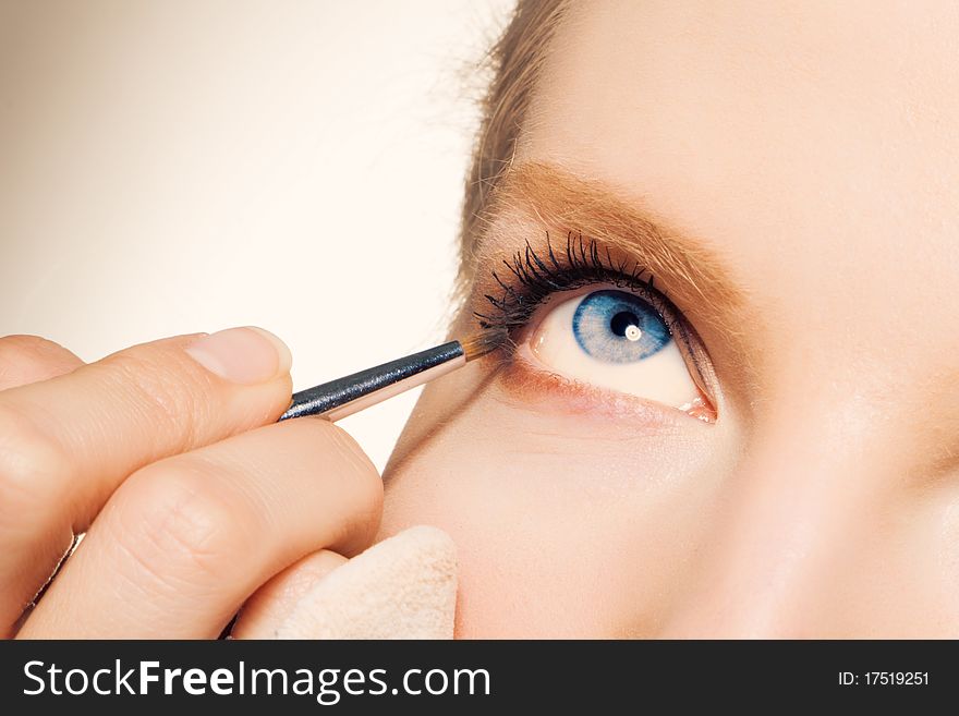 Charming Young Woman Applying Blusher Eyelid
