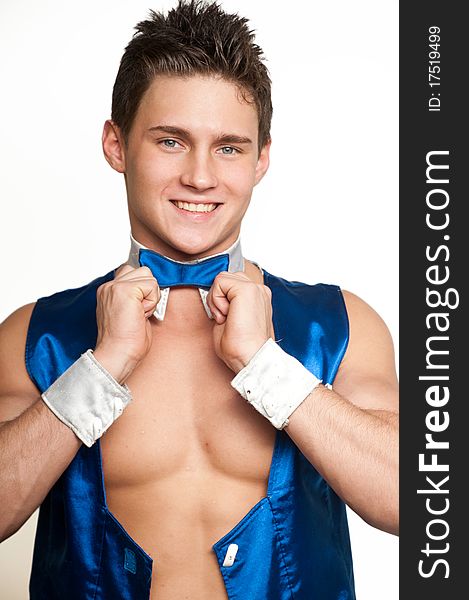 Muscled male model in blue dance suite on isolated white