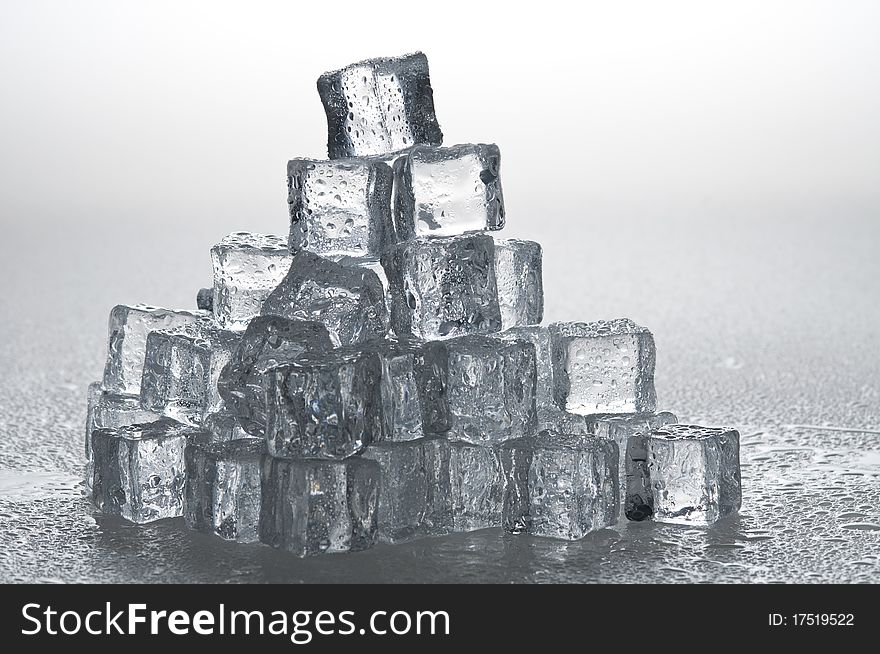 Wet ice cubes objects over water surface