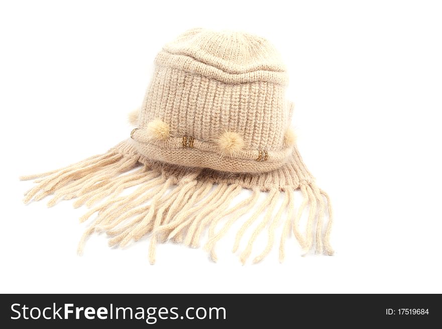 Warm knitted cap with a scarf on a white background