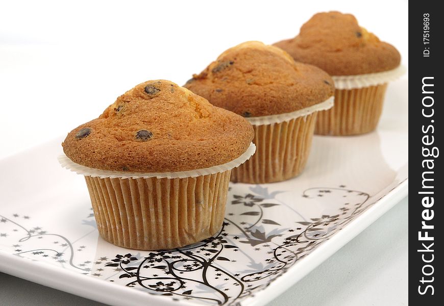 Fresh baked muffins on plate