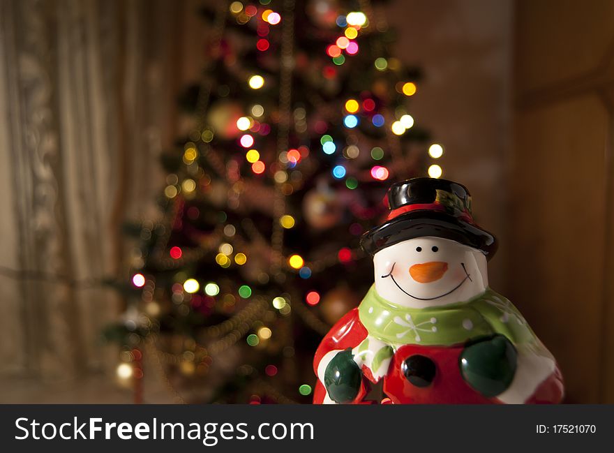 Santa Claus with a blurred Christmas Tree on the background. Santa Claus with a blurred Christmas Tree on the background