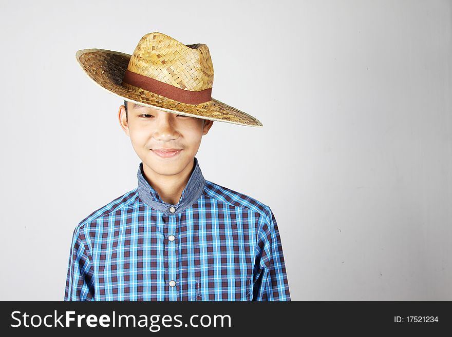 A smile boy wearing farmer hat. A smile boy wearing farmer hat