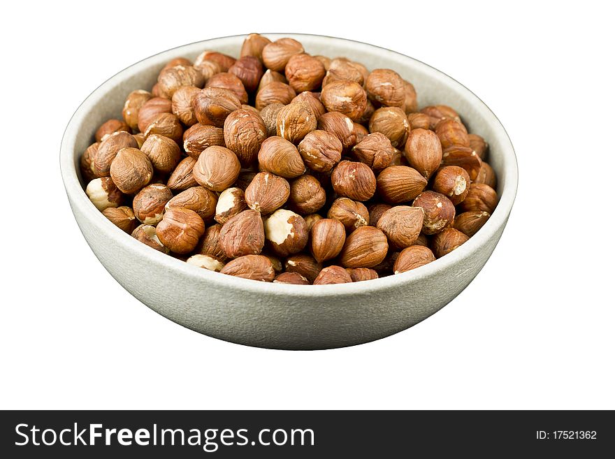 Hazelnuts in a bowl isolated