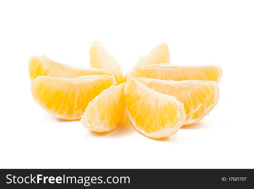 Closeup view of tangerine sections isolated on the white