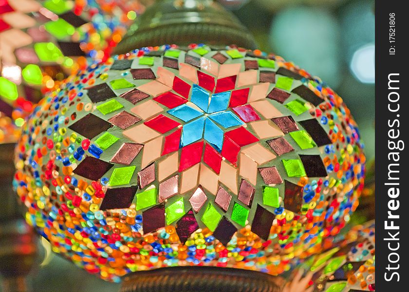 Ornate glass lights at a market stall