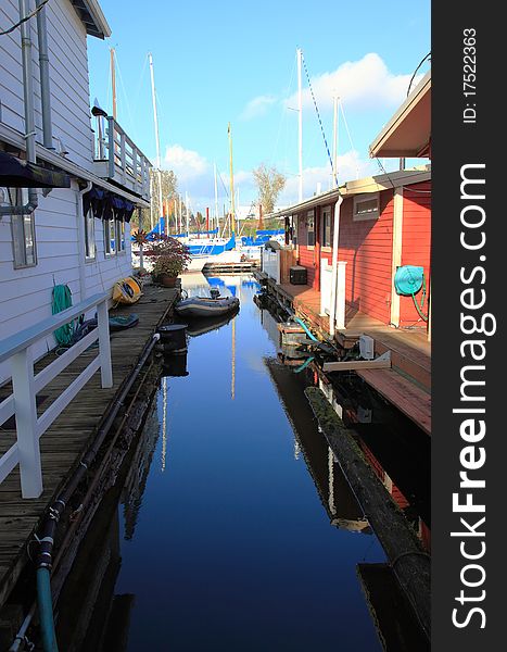 An alley way between two floating houses in the bayou separated by water. An alley way between two floating houses in the bayou separated by water.