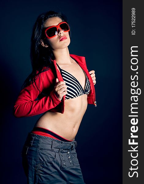 woman portrait on dark background with sunglasses. woman portrait on dark background with sunglasses