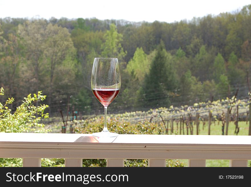 Enjoy a glass of wine at a vineyard. Enjoy a glass of wine at a vineyard.