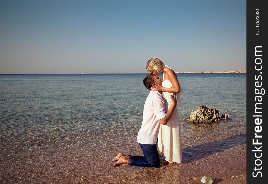 Couple  Kissed On Beach