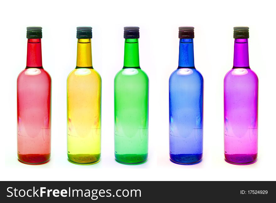 Bottles with diffrent colors on white background