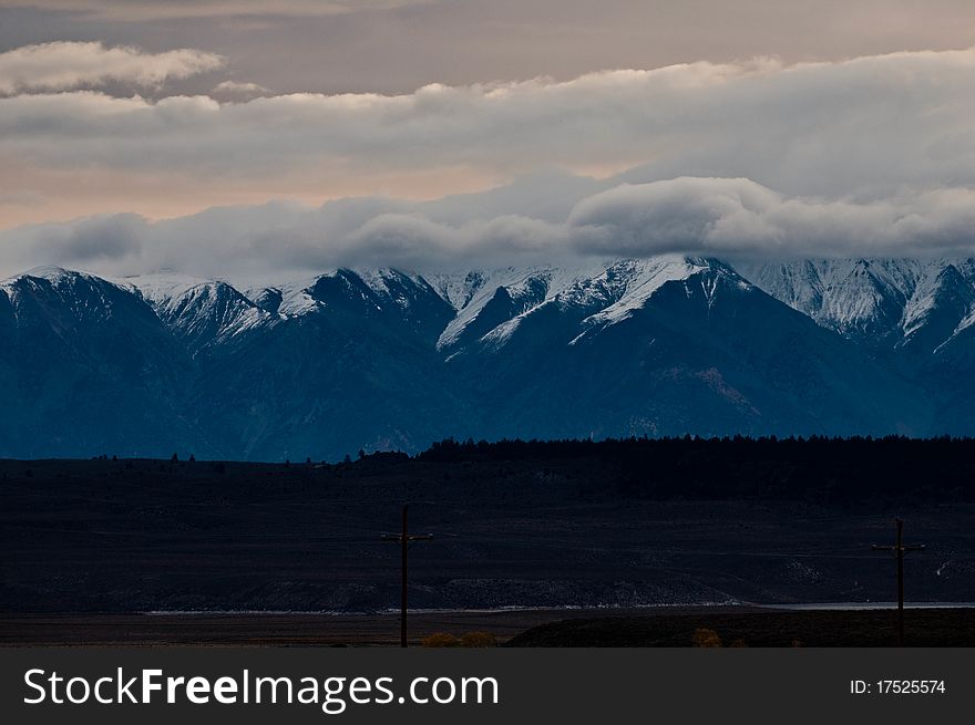 Wild mountain landscape, snow-clad high peaks, snow and early morning. Wild mountain landscape, snow-clad high peaks, snow and early morning