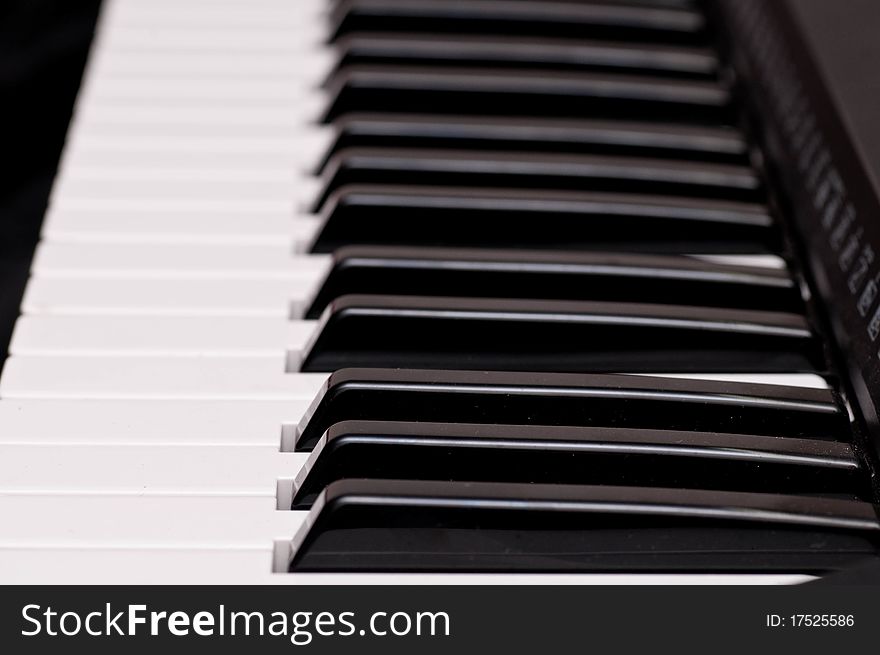 Close up shot of black and white keys of a piano. Close up shot of black and white keys of a piano