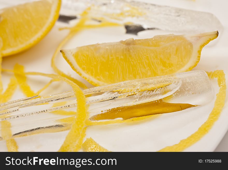 Food series: sliced peel decorated lemon with ice. Food series: sliced peel decorated lemon with ice