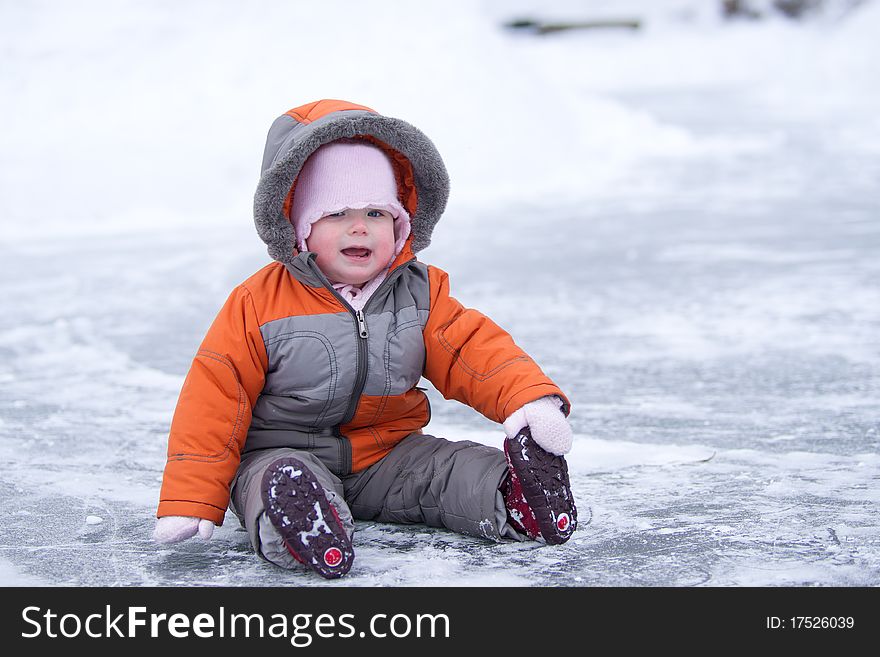 Cute Wondered Baby Sit On Lake S Ice And Smile