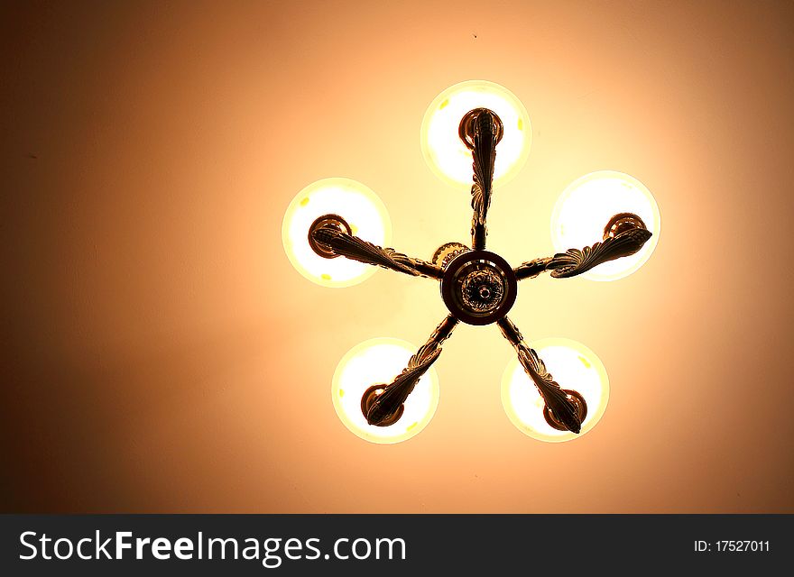 Elegant luxury lamp on warm light background