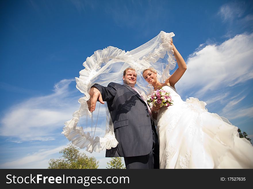 Bride and groom under the veil. Bride and groom under the veil