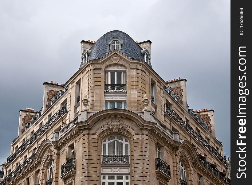 This shot of an apartment building was taken in Paris, France, on an overcast day. This shot of an apartment building was taken in Paris, France, on an overcast day.