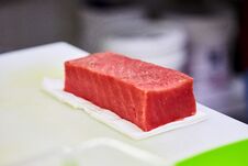 Steak Of  Tuna Fish Fillet On A Cutting Board - Fish And Seafood Stock Photography