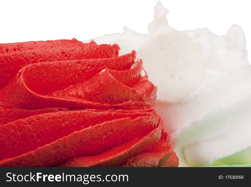Cream of red and white colors as decoration on the cake. Cream of red and white colors as decoration on the cake.