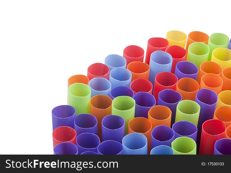 Plastic tubes of different colors in the background.