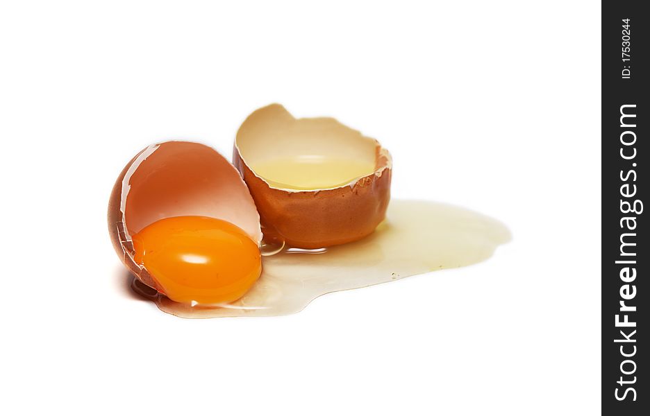 Broken brown hen's egg isolated on white background. Broken brown hen's egg isolated on white background