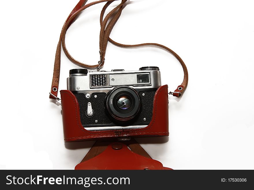 The Soviet film camera in a brown leather case  isolated on white. The Soviet film camera in a brown leather case  isolated on white