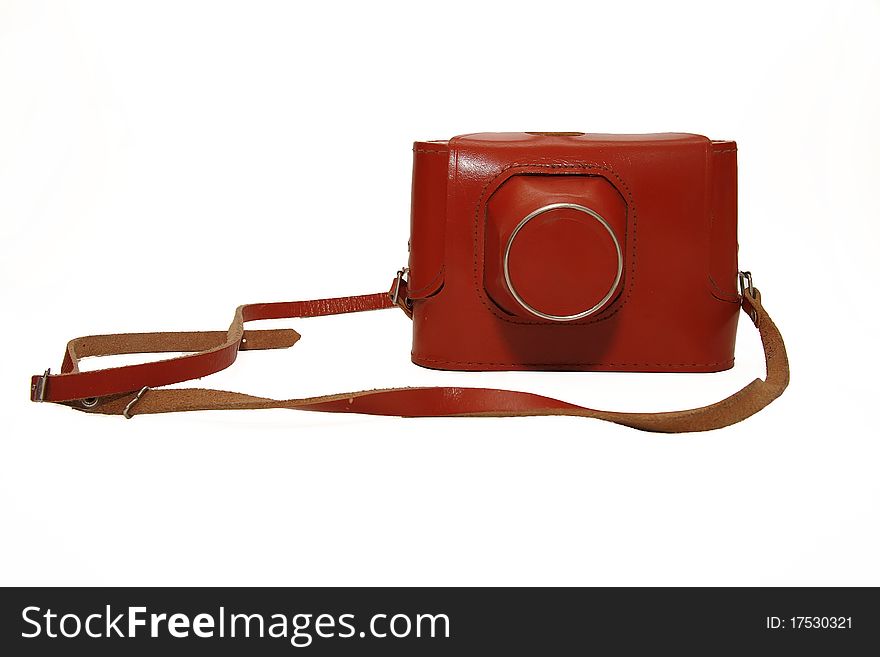 The Soviet film camera in a brown leather case isolated on white. The Soviet film camera in a brown leather case isolated on white
