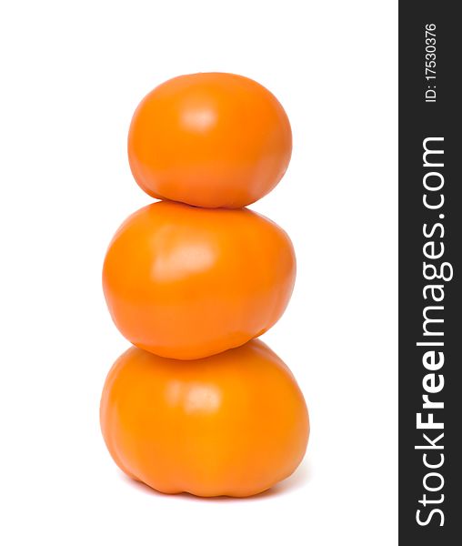 Orange tomatoes closeup isolated on white background. Orange tomatoes closeup isolated on white background.