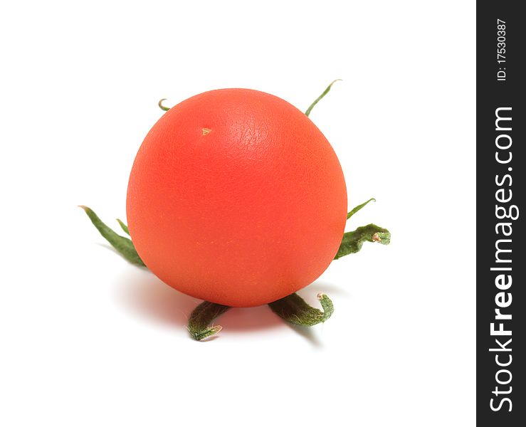 Red tomato close up it is isolated on a white background. Red tomato close up it is isolated on a white background.