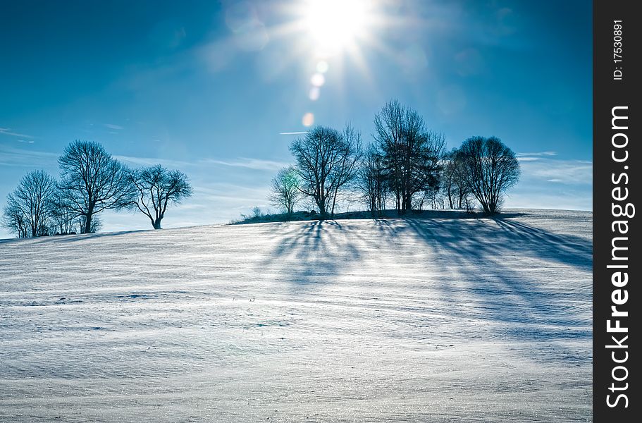 Sun Over Snowy Hill