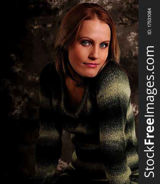 In a sweater on a gray background. In a sweater on a gray background