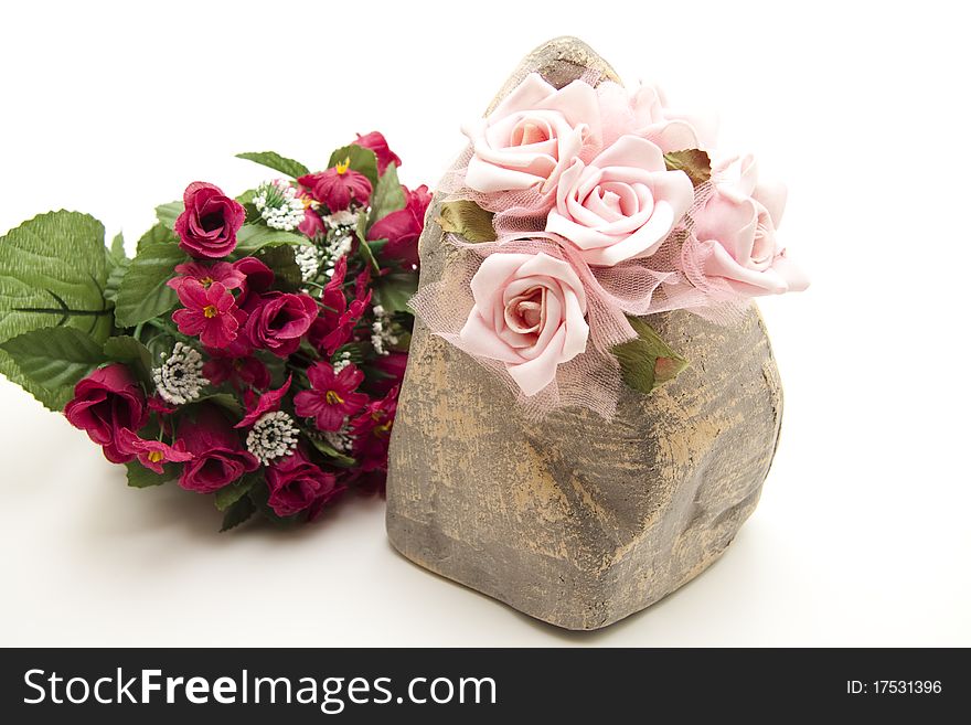 Bunch of roses in the stone vase