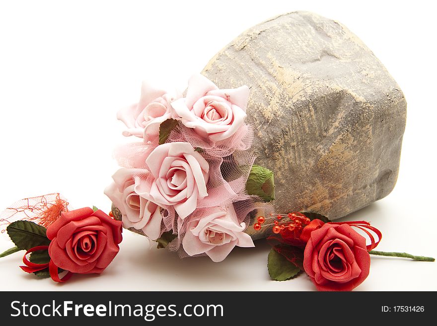 Bunch of roses in the stone vase